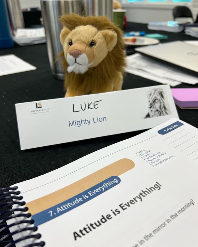 Lion mascot with Animal Selling training materials
